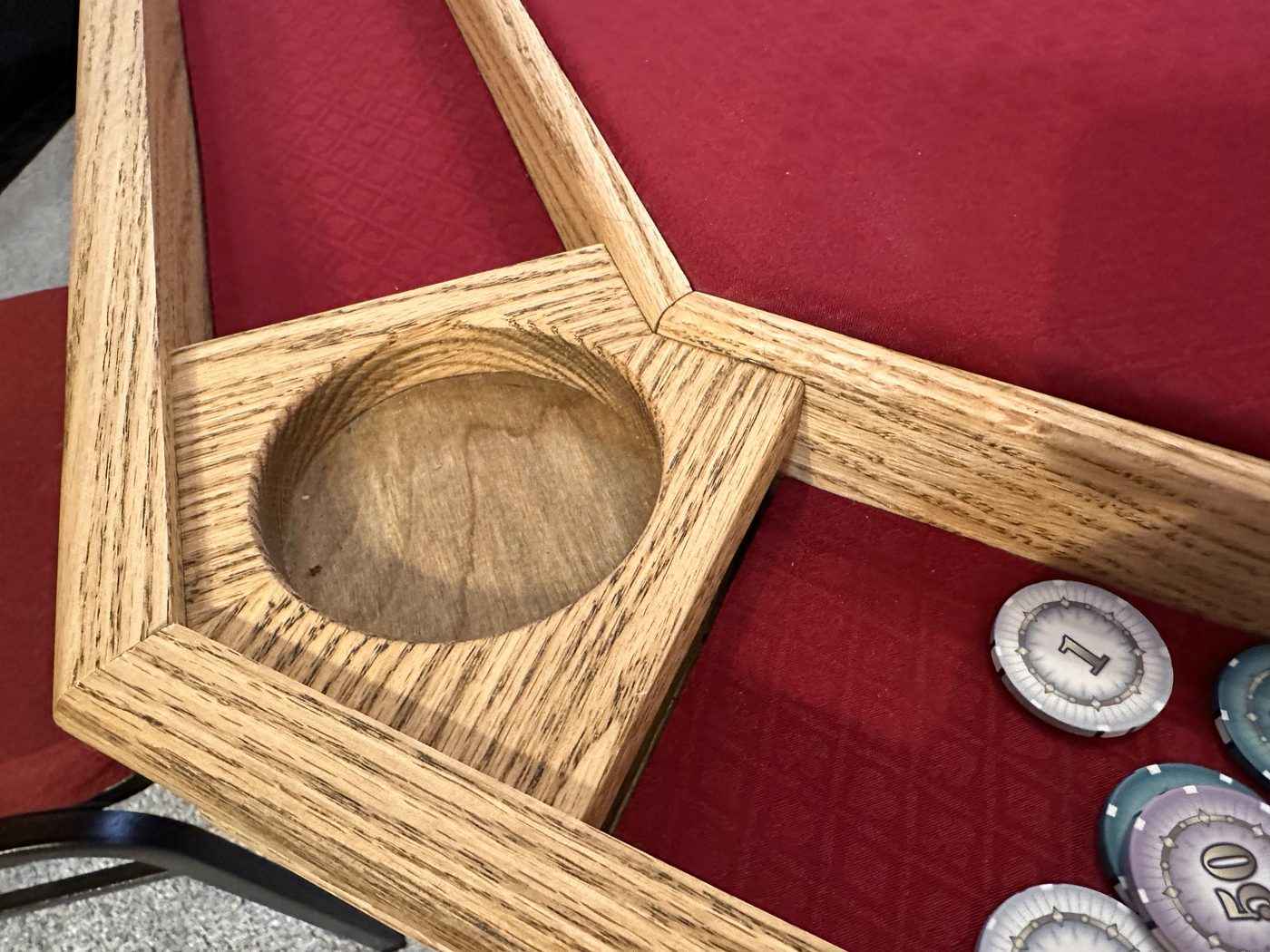 Close view of an oak cupholder bore and rail joinery